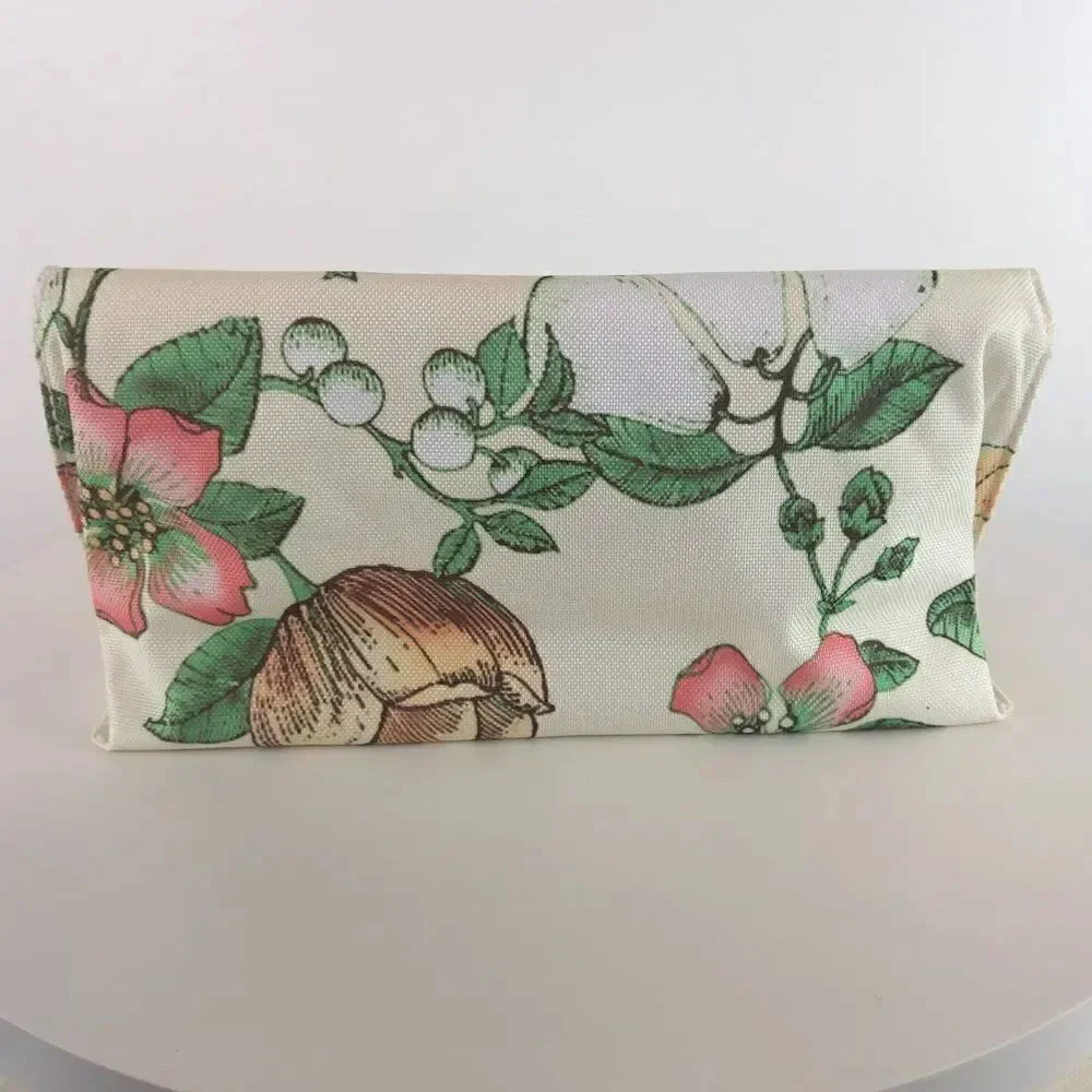 Clinique cream floral print fold over makeup / jewelry bag.